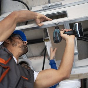 low-angle-people-working-with-drill